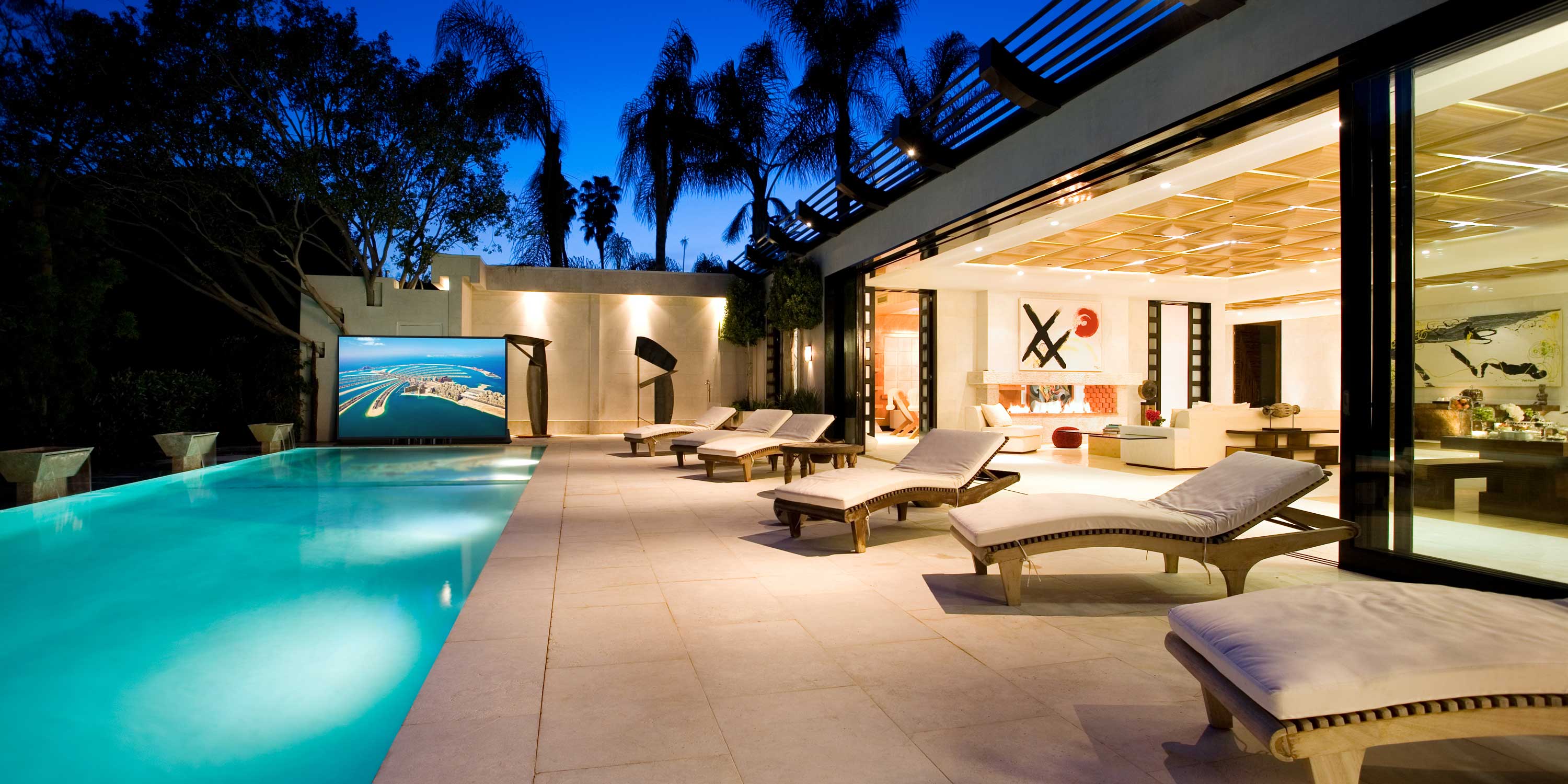 pool, evening, palm tree silhouettes, beach chairs