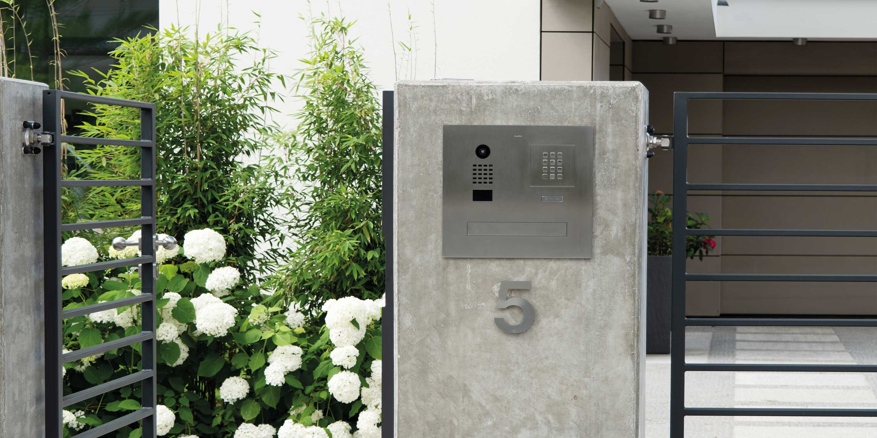 Silver intercom, gate, white flowers, 5