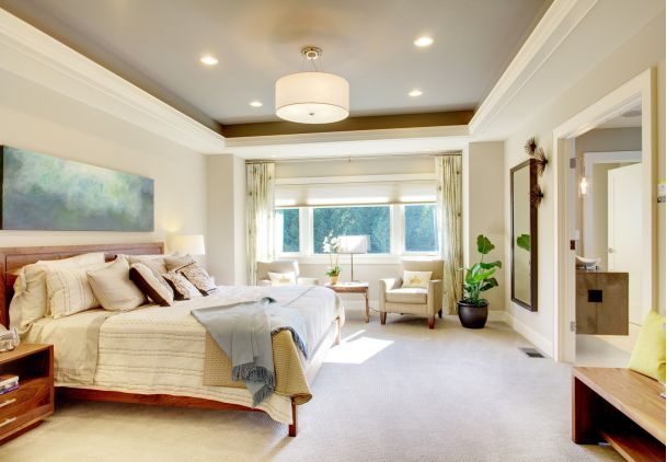 Bedroom with pale walls and lighting