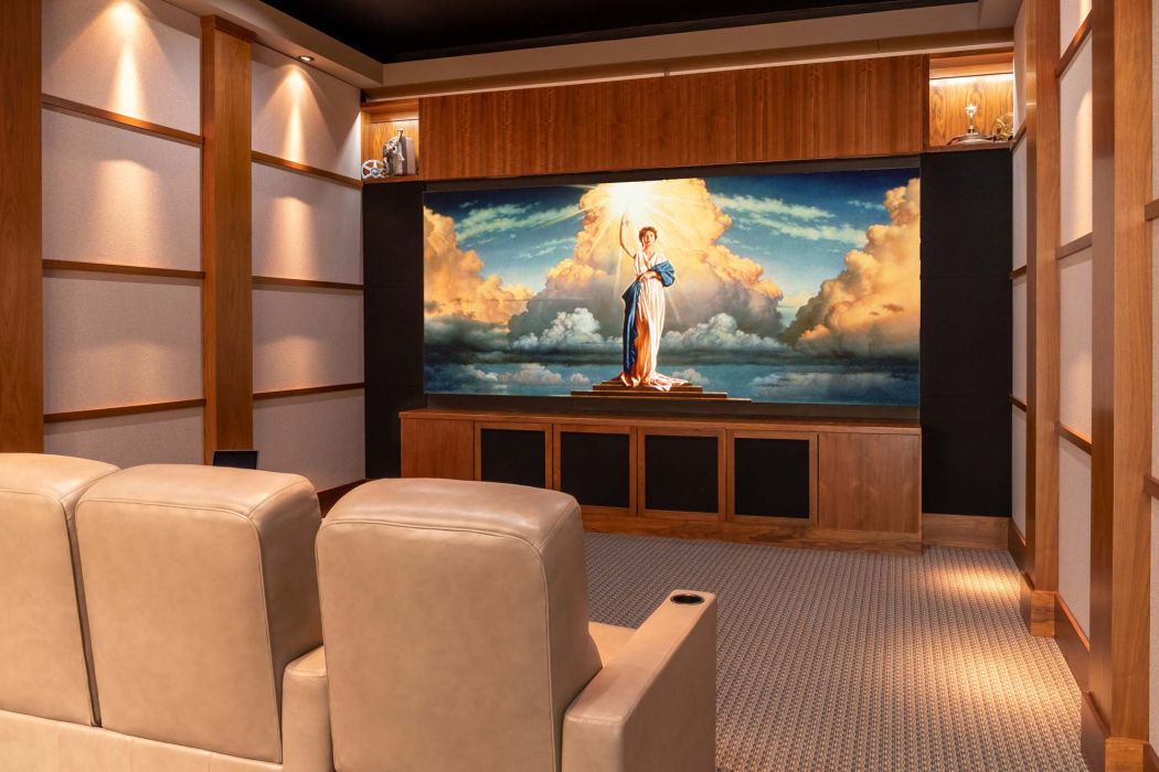 Women sitting at wooden table with laptops